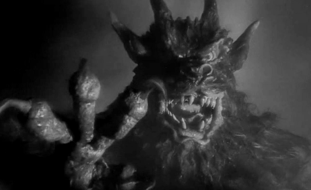 The demon reaches out