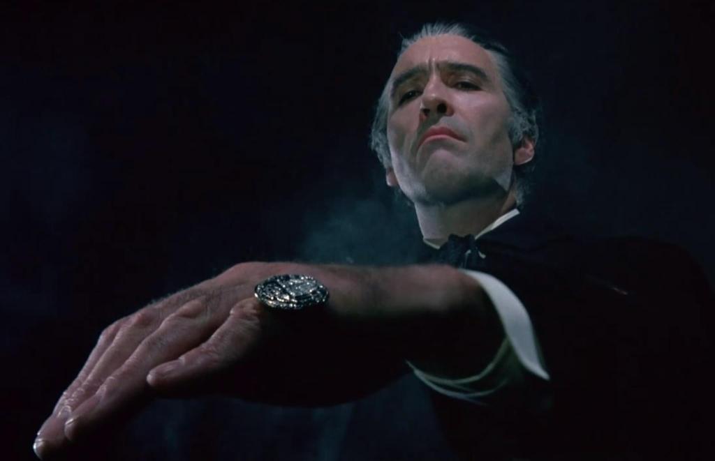 Dracula holds out his hand