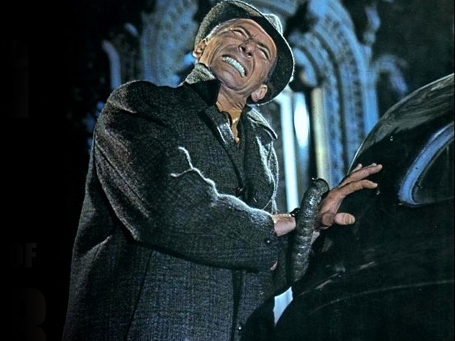 Peter Cushing is grabbed by tentacle