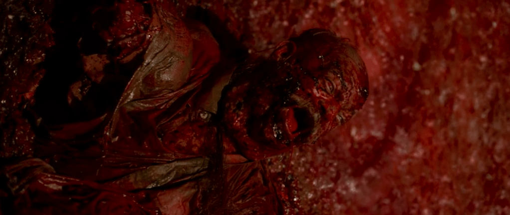 A victim trapped within the fleshy wall of the womb-room