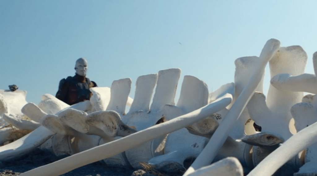 A Sedonian walks past a big skeleton