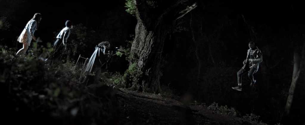 The guy with the rifle can't see the monster holding up Ethan because he hasn't munched on human flesh