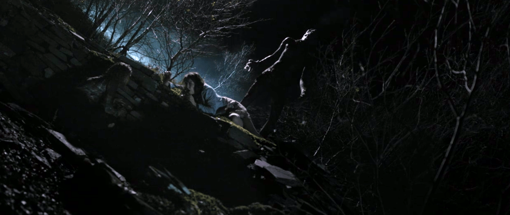 The creature looms over a victim