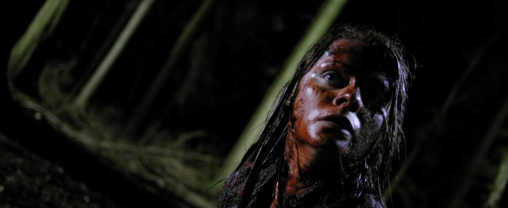 Nat covers herself in another victim's blood