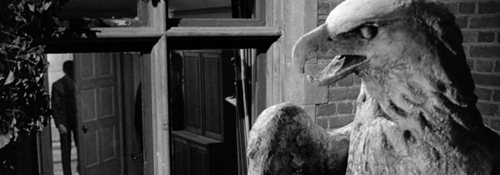 The stone eagle looms in the foreground