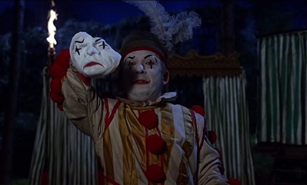 The dwarf removes his makeup