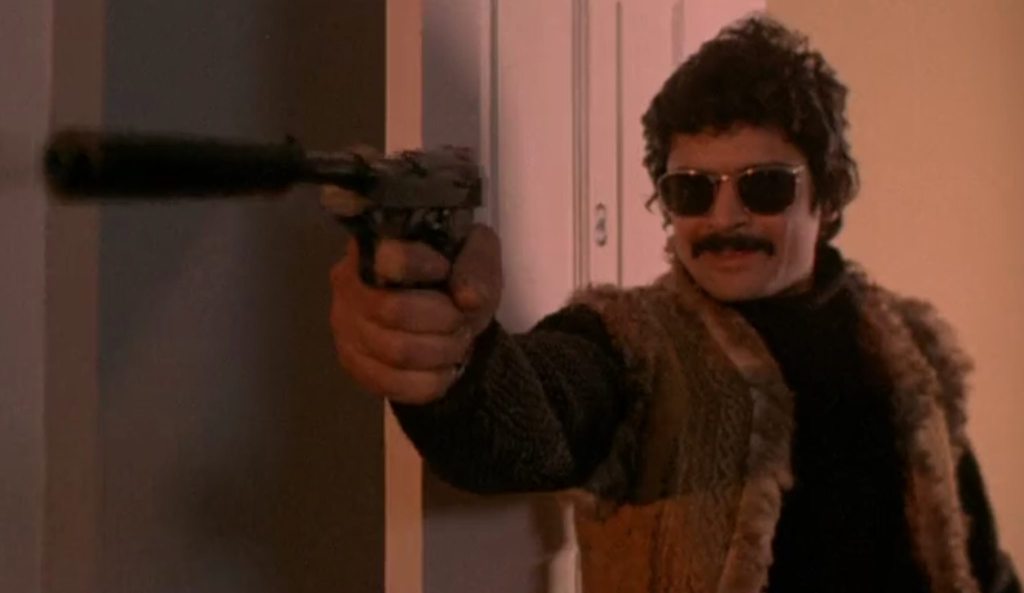 Sheepskin-waistcoated biker with a silencer!