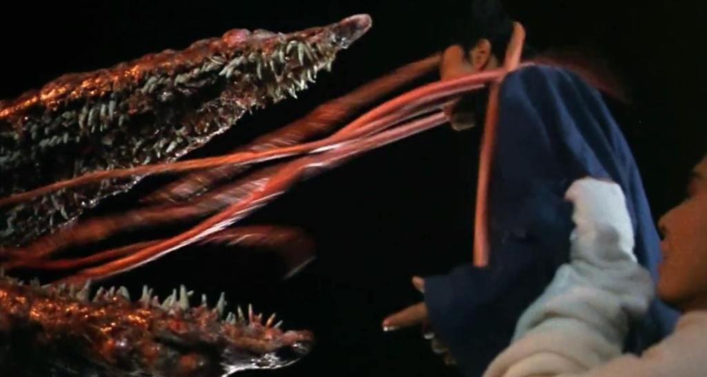 A giant tongue sprouts a toothy mouth and tentacles!