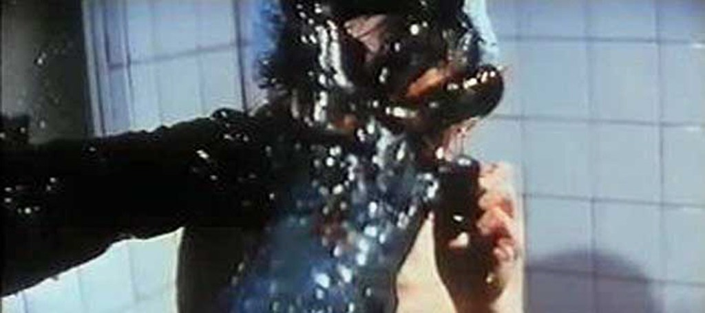 Glistening-skinned monster hands grab a victim in the shower