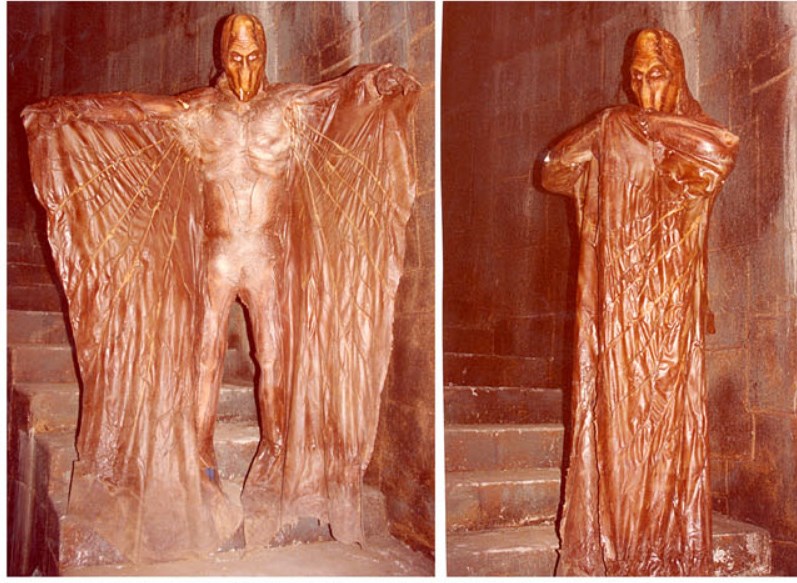 Behind the scenes shot of the winged devourer costume