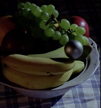 The Glitterball prepares to eat a banana...