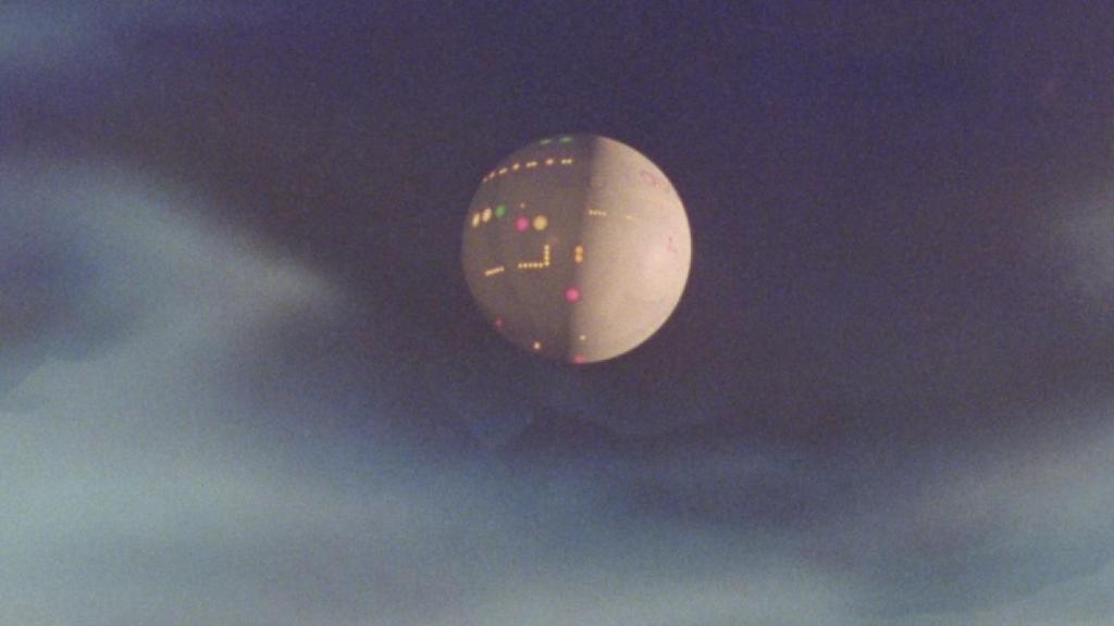 The mothership hovers high in the sky