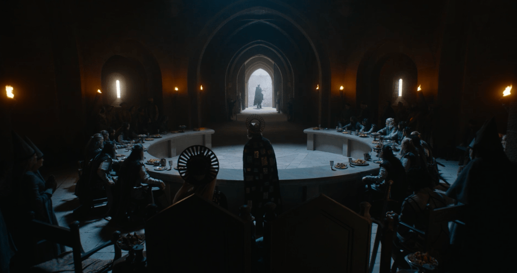 The Green Knight approaches King Arthur