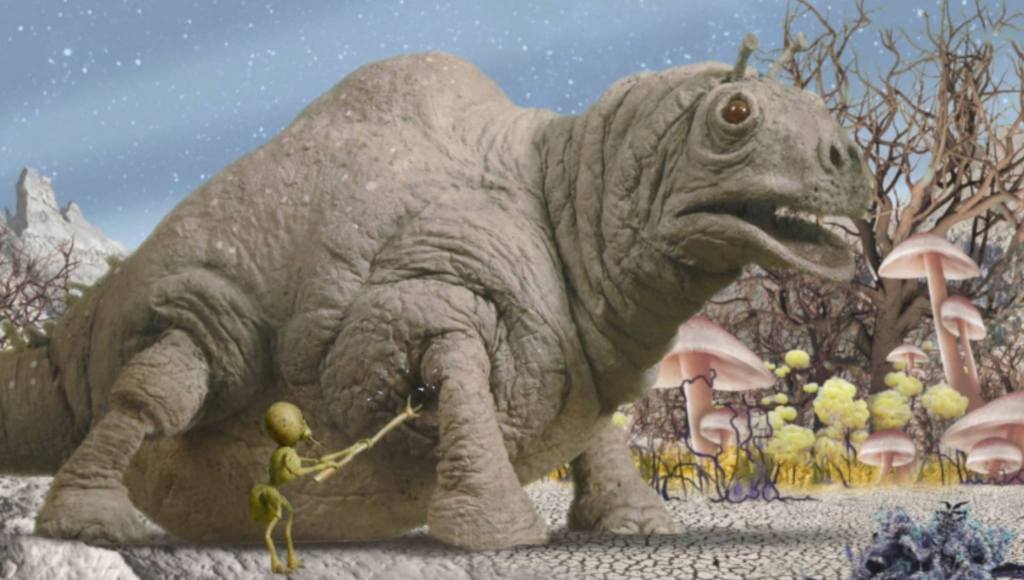 A mooncalf is prodded by a Selenite