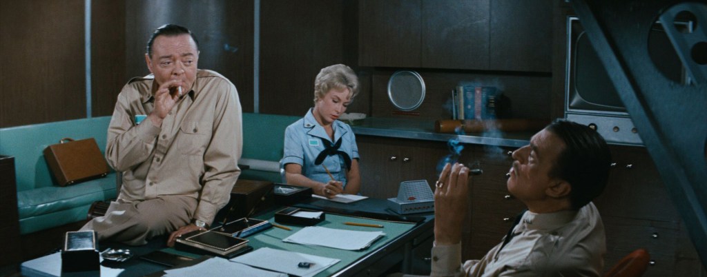 Walter Pidgeon and Peter Lore have a smoke