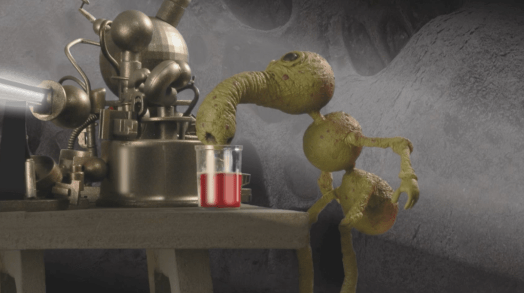 A Selenite scientist uses a specifically-designed nose to sniff out different chemicals