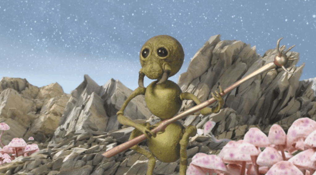 A Selenite holds a prodder-type staff that can give off electric shocks