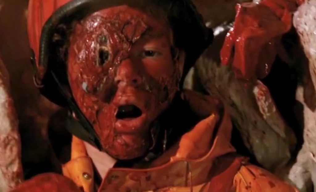 Blobby alien attacks a victim in a cave!