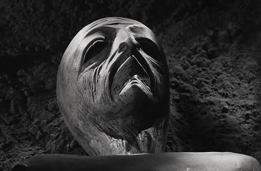 An alien's face is revealed