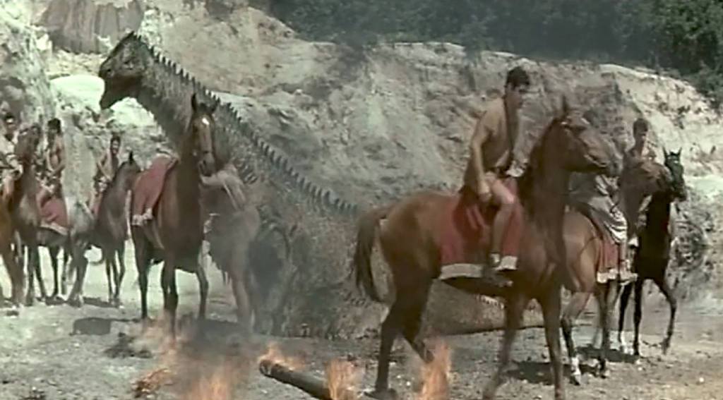 The dragon attacks a group of mounted men!