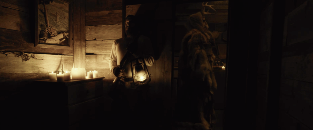 Adam hides from the antler people that enter his home