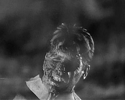 A crew member has his face melted off!