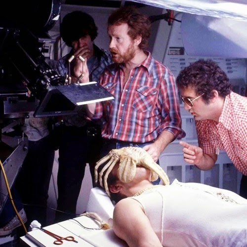 Roger stands behind Ridley Scott on the set of ALIEN