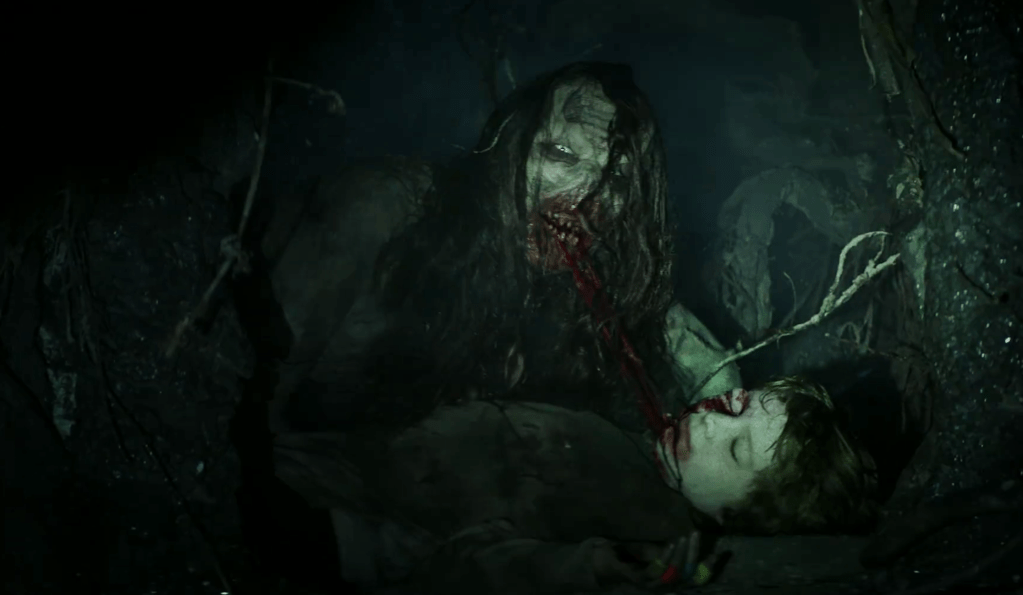 Yikes! Dillon's dead body gets chewed on by the witch!