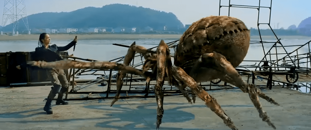 Female rescue team member dodges a thrusting spider leg!