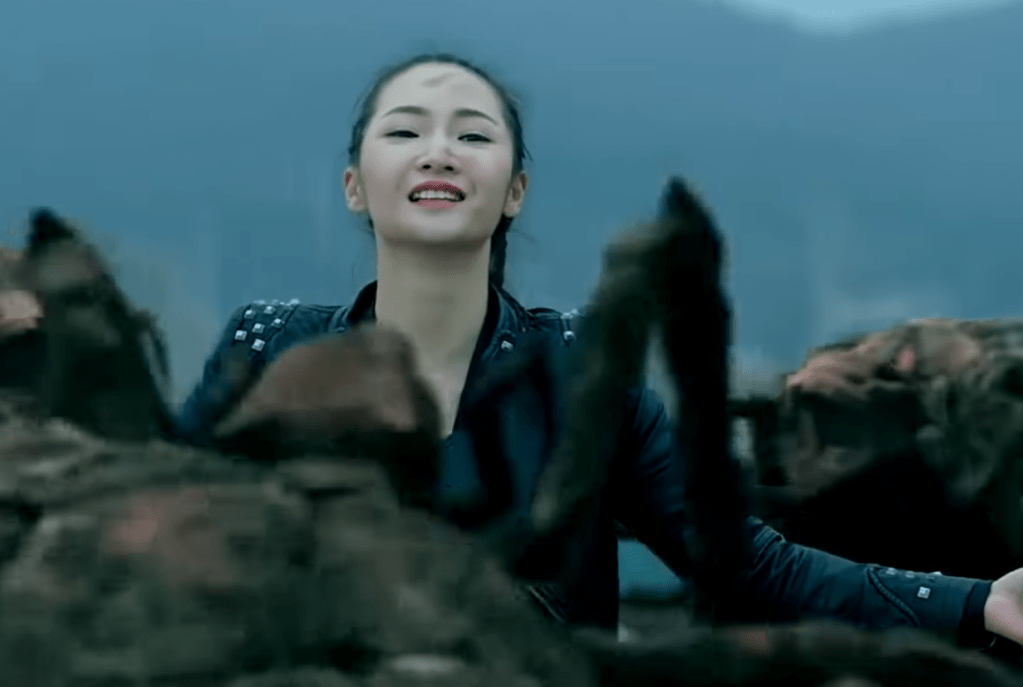 A character prepares to blow herself up