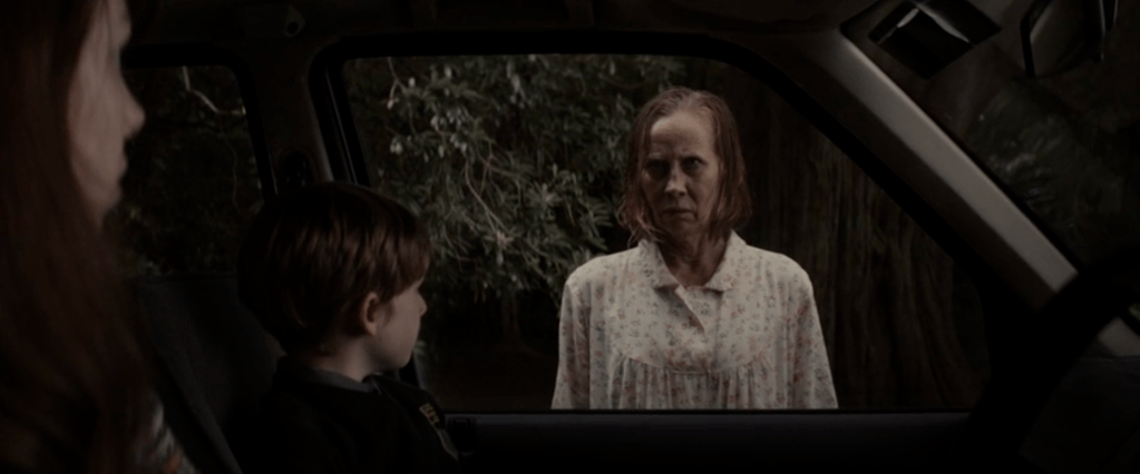 Creepy local old woman Noreen Brady... just before she starts bashing her head against the car window