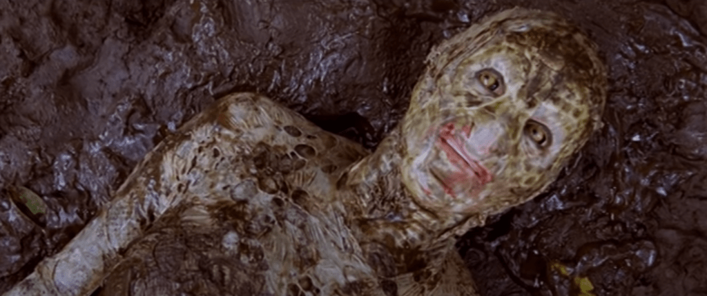 ...emerges the female snake-creature...