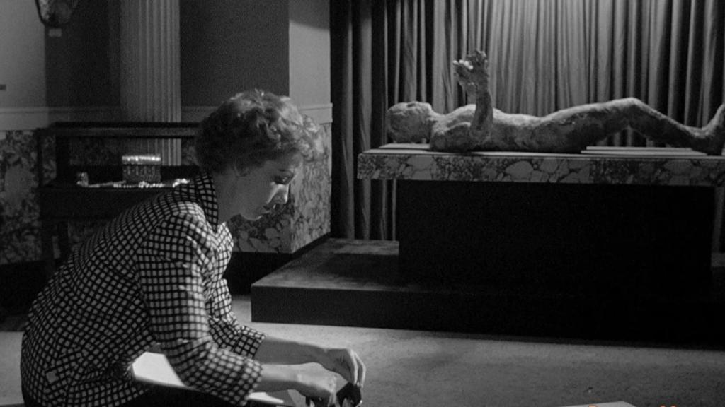 Tina sits in the museum... unaware that the Faceless Man will soon reanimate!