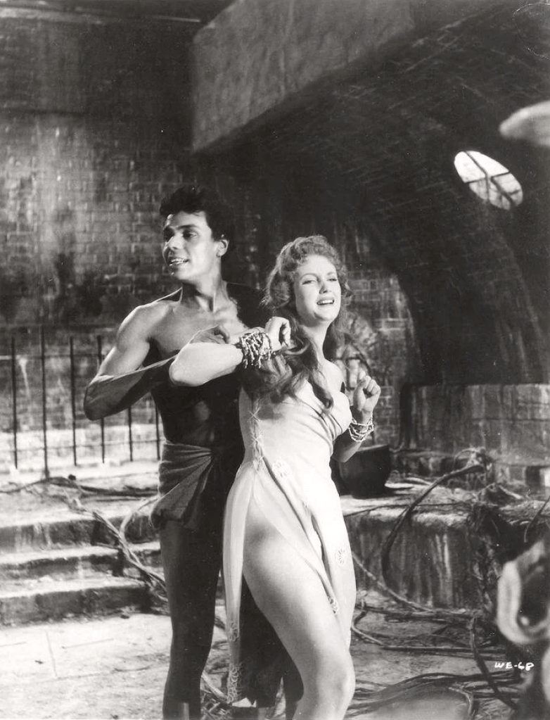 Tanga, the tribal drummer, prepares another victim for the Amazonian plant-thing