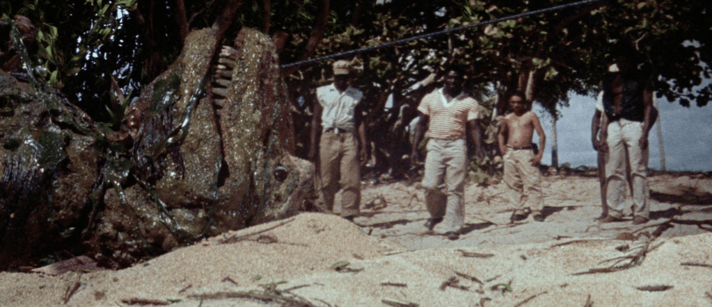 The frozen Tyrannosaurus Rex is dragged ashore