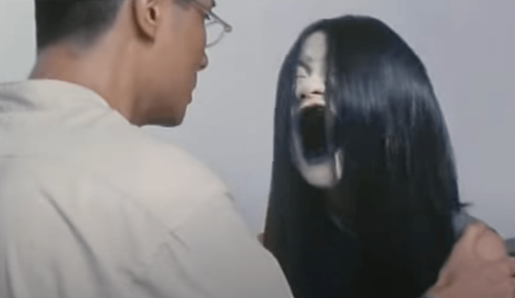 Pale face, dark mouth...