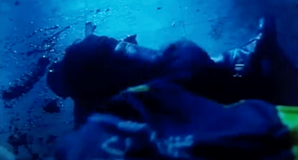 A zombie cop grabs his own severed foot so that he can club Ka-Ming around the head with it!