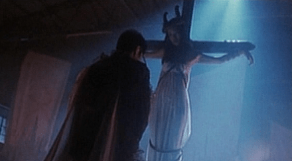 Judas, an envoy of Satan, prepares to remove a victim's heart