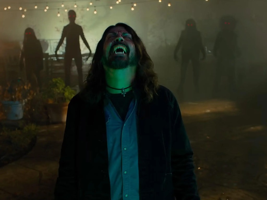 A fanged, possessed Grohl and some red-eyed demon-dudes