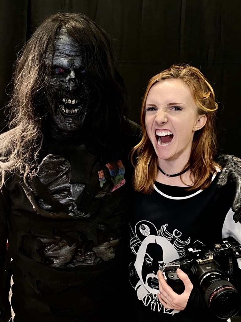 Tony Gardner, in full zombie makeup, poses with his daughter Kyra