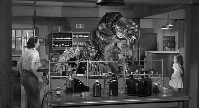 Little Sandy MacKenzie turned up the heat in the lab so that the caged rabbits wouldn't be cold... and this causes the monster to hatch! So she's to blame for all the rabbits being eaten!