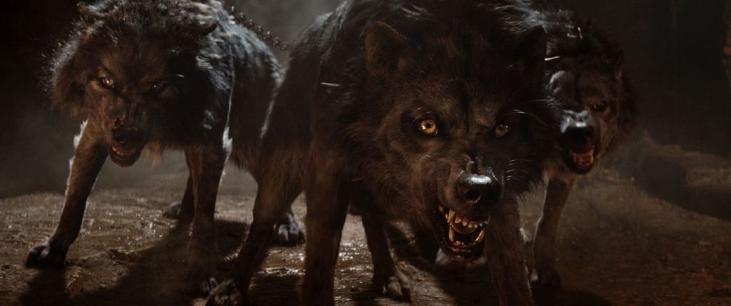 ...is revealed to be three feral, snarling wolves owned by King Eurystheus (Joseph Fiennes)