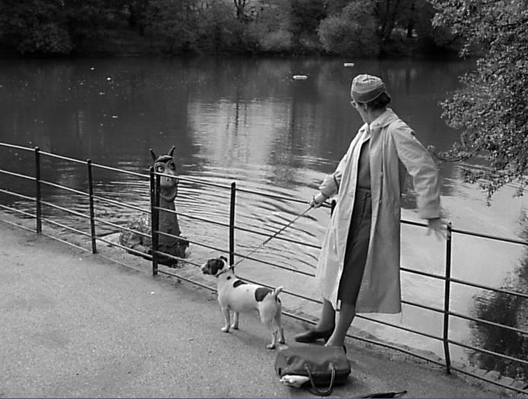 A dog-walking busybody gets spooked by the pond-loving beastie