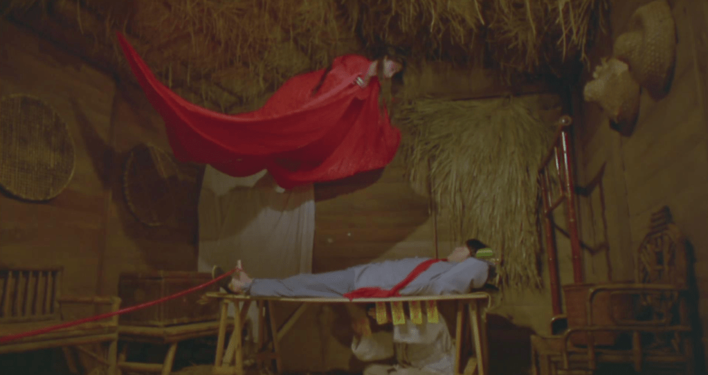 A ‘palm tree spirit’ hovers over one of the priest's disciples 