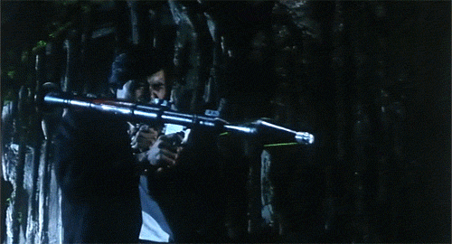 Chow Yun-Fat blasts the monster to smithereens with a rocket launcher. Well, of course he does!