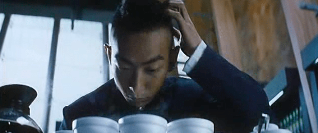Alien brushes some of his dandruff into the coffee he's going to give the FBI...