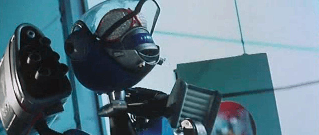 
The RS1's extendable hand grabs the Jerry L robot's neck and wrenches its head off! 