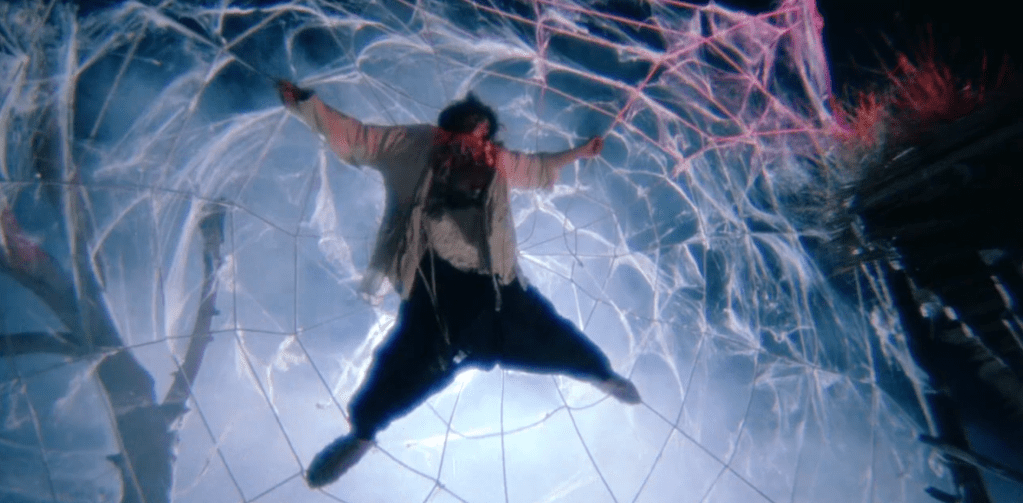 Joker gets trapped in a big spiderweb...