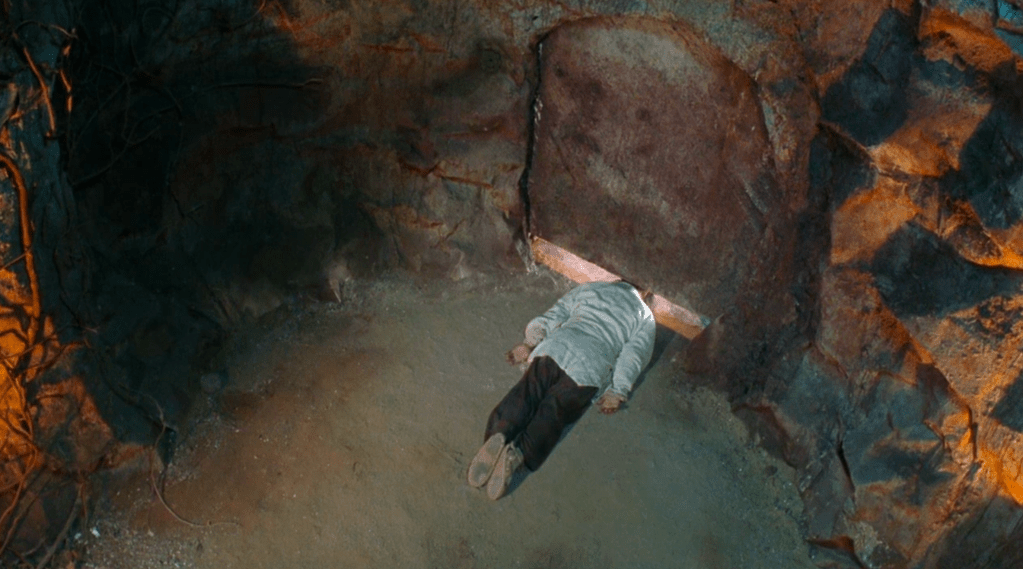 Joker's head becomes trapped under a sliding door