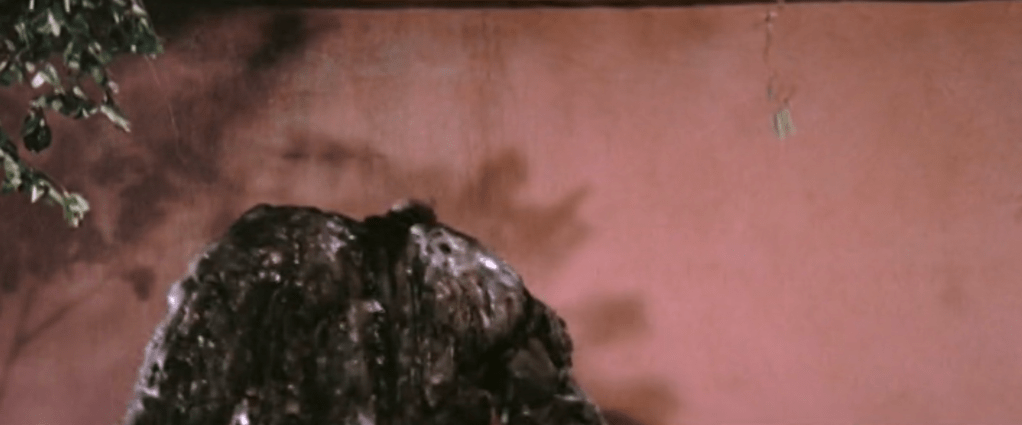 Oily Maniac's head is cut off...